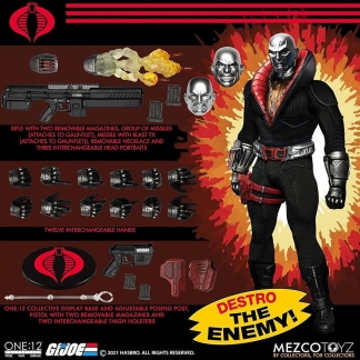 "Promotional image for Mezco One:12 Collective Destro action figure, showing Destro in his black and red suit with a silver mask on the right, and all included accessories laid out on the left, including three interchangeable head portraits, a rifle, missiles with blast FX, and twelve interchangeable hands."