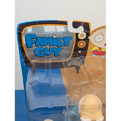 "Angled rear-right view of a boxed Mezco Family Guy Herbert action figure, showing the back of the carded packaging with character art."
