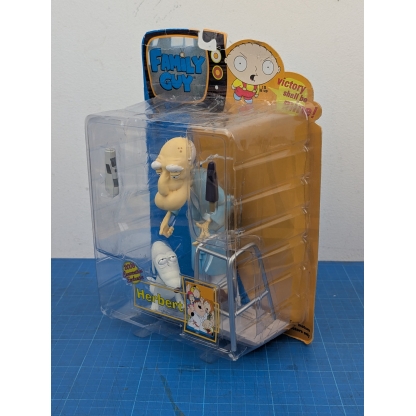 "Top-down view of the boxed Mezco Family Guy Herbert action figure, showing the top of the packaging and the figure's head."
