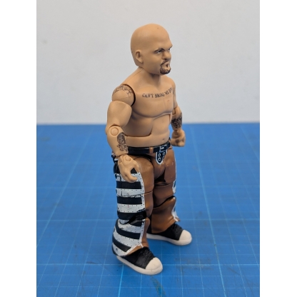 Right side view of a loose WWE Mattel Elite action figure of Hornswoggle, showing his right arm and leg."