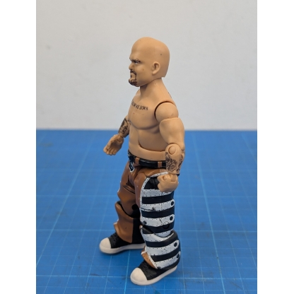 Left side view of a loose WWE Mattel Elite action figure of Hornswoggle, showing his left arm and leg.