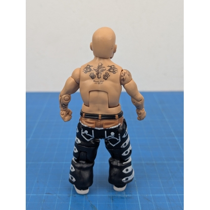 Back view of a loose WWE Mattel Elite action figure of Hornswoggle, showing the details on his back and the back of his outfit."