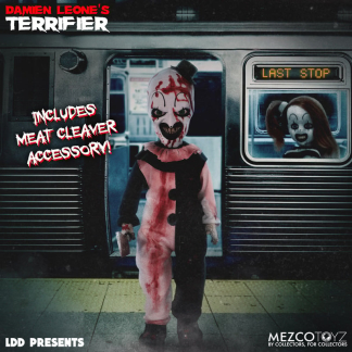 A Living Dead Doll of Art the Clown from Terrifier stands on a subway platform. He wears a blood-splattered black and white clown suit, a top hat, and has a terrifying grin with green eyes. A subway car is behind him with "LAST STOP" visible, and another clown figure is seen through the window. Text "INCLUDES MEAT CLEAVER ACCESSORY!" is on the left.