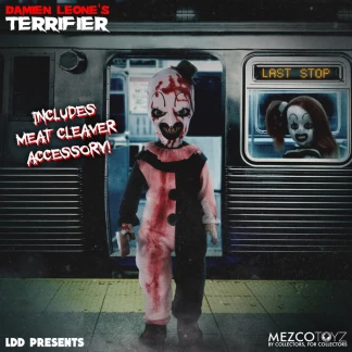 A Living Dead Doll of Art the Clown from Terrifier stands on a subway platform. He wears a blood-splattered black and white clown suit, a top hat, and has a terrifying grin with green eyes. A subway car is behind him with "LAST STOP" visible, and another clown figure is seen through the window. Text "INCLUDES MEAT CLEAVER ACCESSORY!" is on the left.