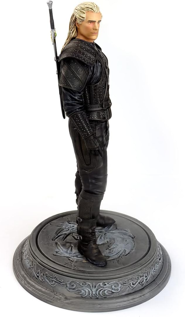 Side profile of the Witcher Geralt figure showing the detailed white hair and silver studs on armor.