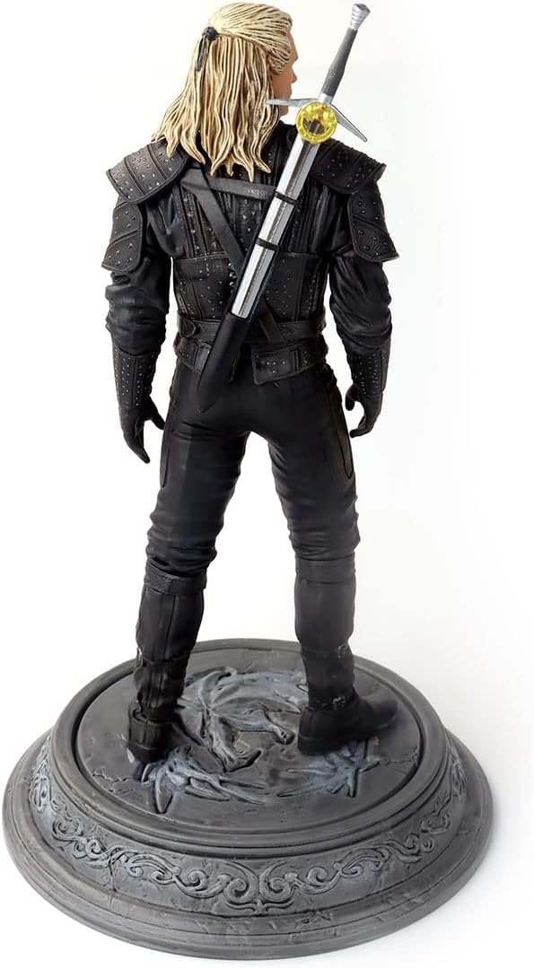 Side profile of the Witcher Geralt figure showing the detailed white hair and silver studs on armor.