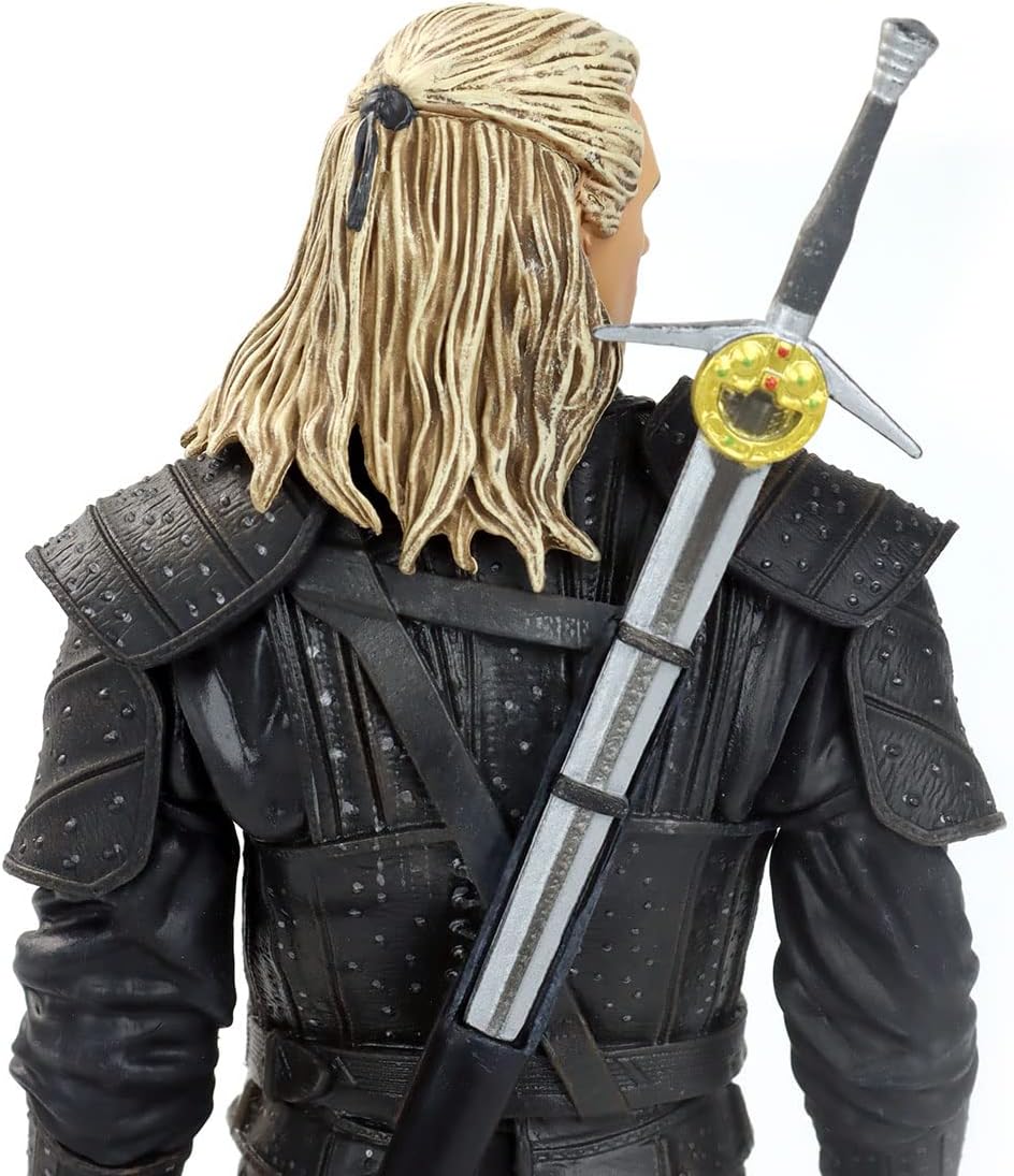 Side profile of the Witcher Geralt figure showing the detailed white hair and silver studs on armor.