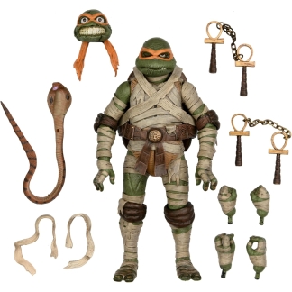 Detailed shot of the figure's accessories, including the swappable "screaming" head, extra hands, and the cobra-themed weapons.