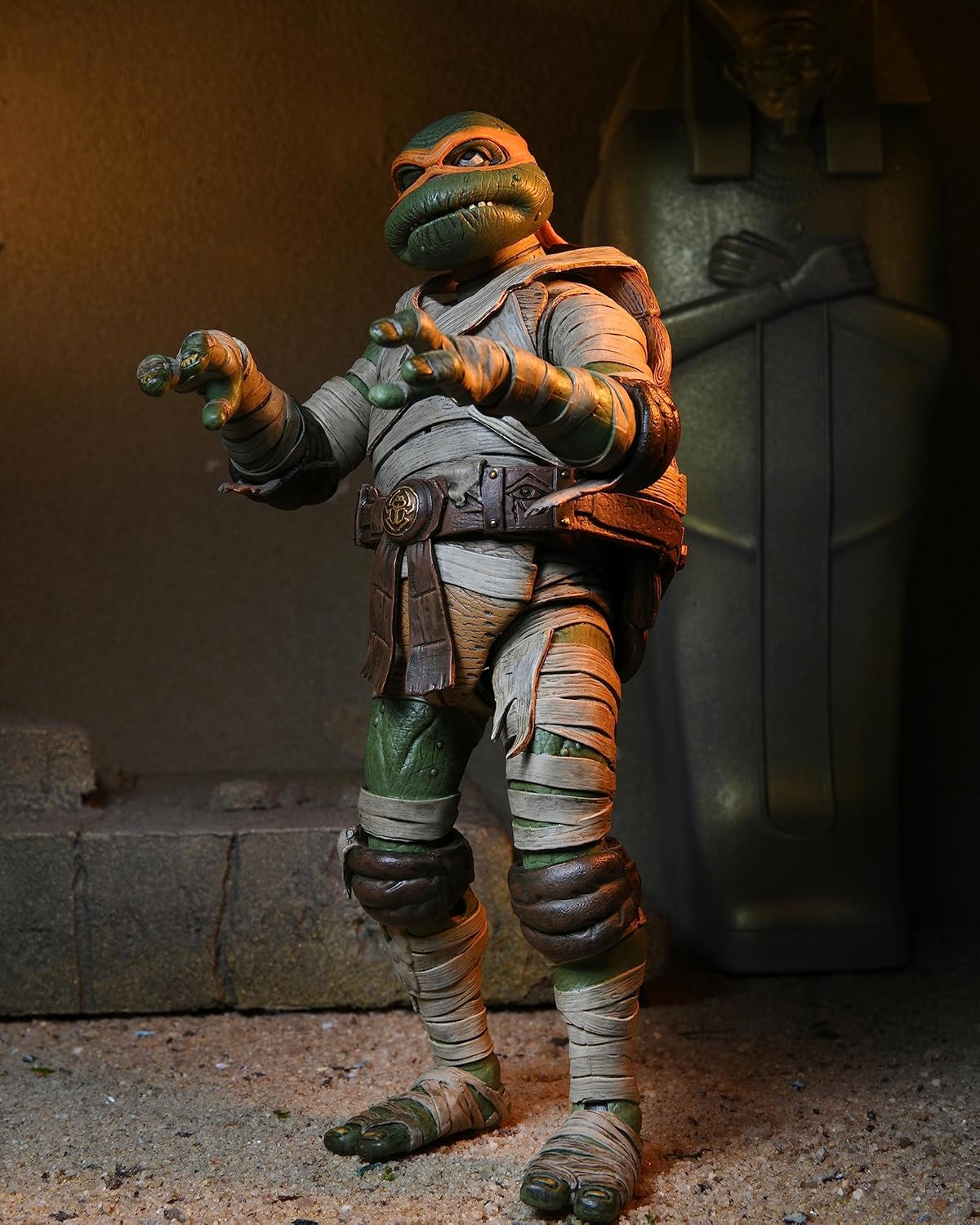 : Close-up of the Michelangelo as The Mummy figure out of the packaging, highlighting the detailed bandage textures and the orange turtle mask.
