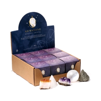 A small, colorful Puckator Gemstone Mystery Crystal Surprise gift box with mystical star and moon patterns.