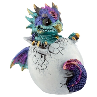 A detailed polyresin figurine of a small blue and purple dragon hatching from a cracked, bone-colored eggshell