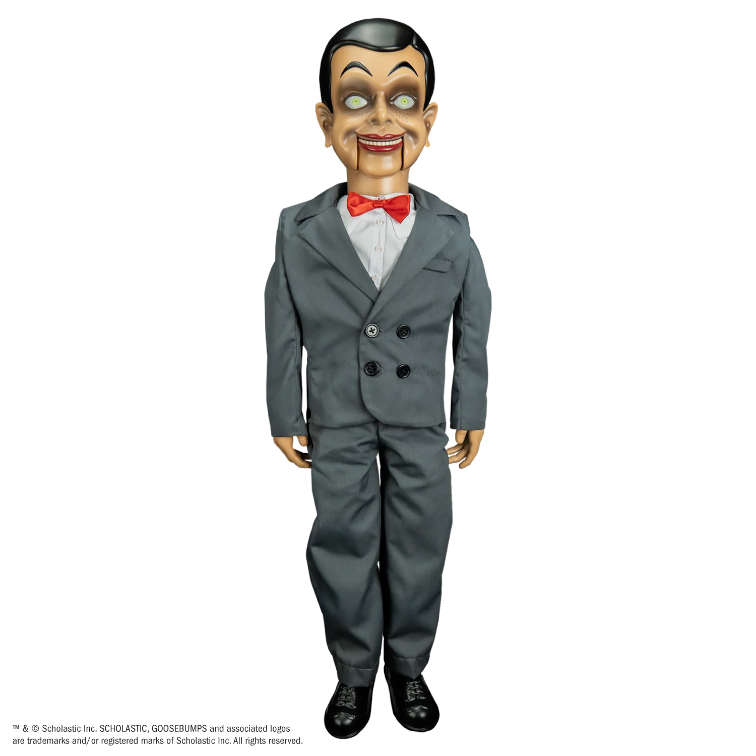 A life-size, 25-inch tall Slappy the ventriloquist dummy wearing his grey suit and red bow tie, standing in a menacing pose