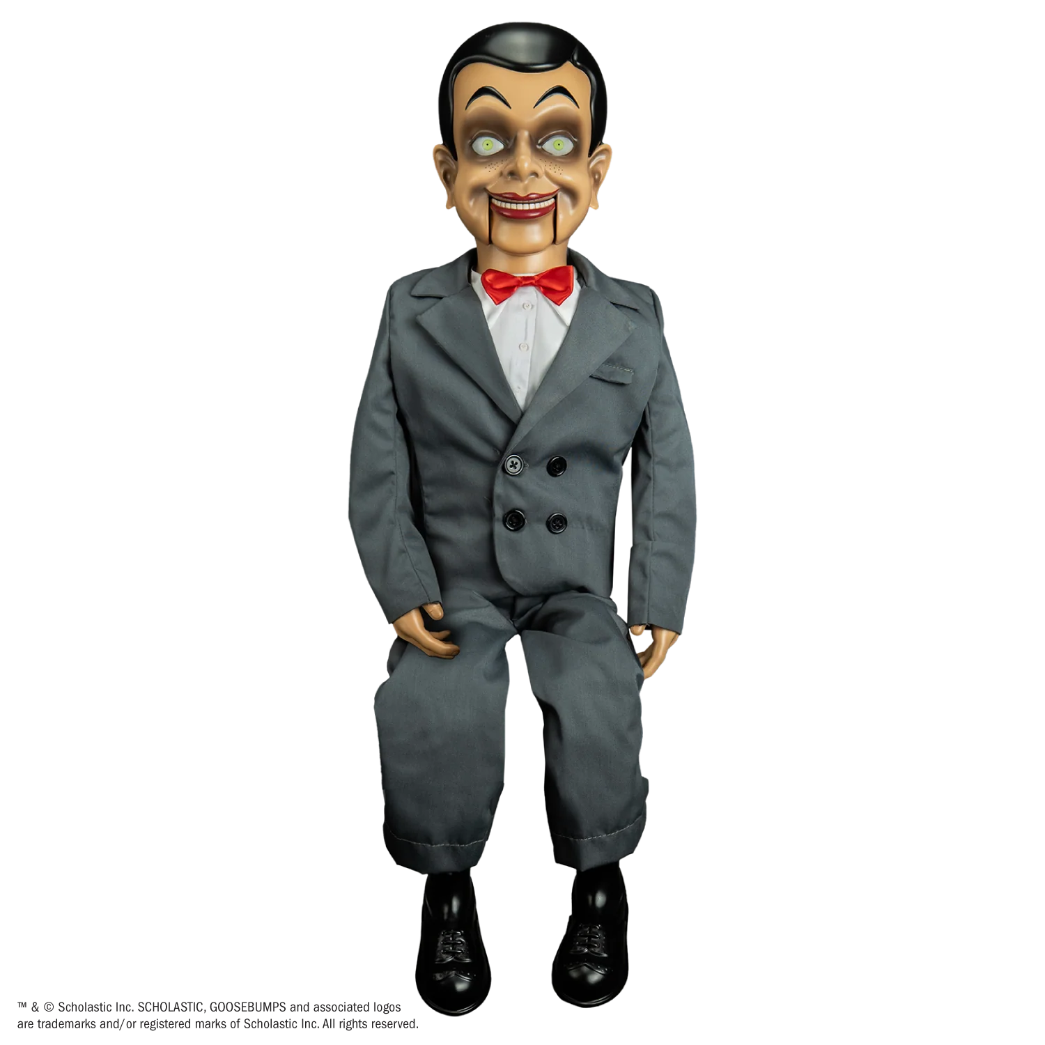 A life-size, 25-inch tall Slappy the ventriloquist dummy wearing his grey suit and red bow tie, standing in a menacing pose