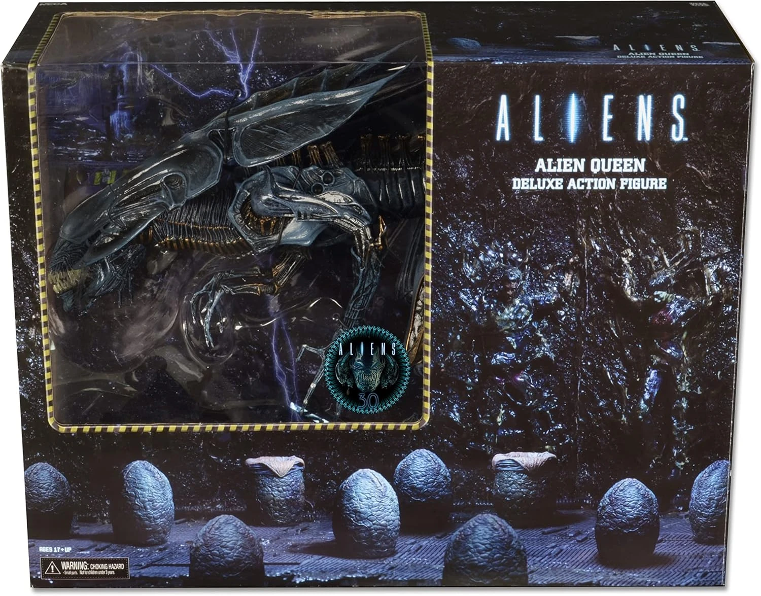 A massive, highly detailed 15-inch tall NECA Xenomorph Queen action figure with a glossy blue-black finish, displayed on a black support stand.