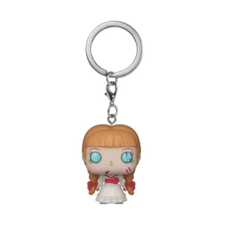 The Funko Pocket Pop! Annabelle keychain standing in front of its miniature window box display