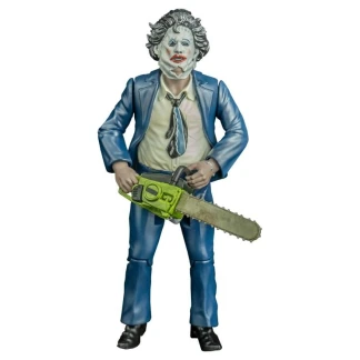 A 5-inch action figure of Leatherface wearing a formal suit and makeup mask, holding a bloody chainsaw in a retro blister pack
