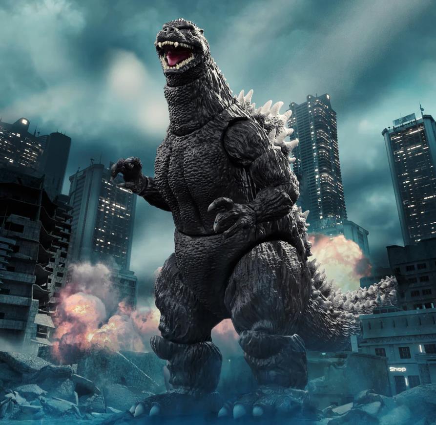 An 8-inch tall articulated Godzilla action figure with grey textured skin and white dorsal fins