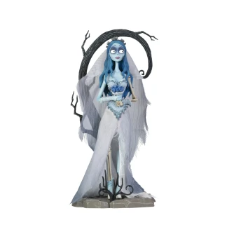 A highly detailed vinyl figurine of Emily from Tim Burton's Corpse Bride standing in a tattered wedding dress on a cobblestone display base with a tiny skeleton dog