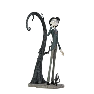 A highly detailed vinyl figurine of Victor Van Dort from Tim Burton's Corpse Bride standing in a black suit on a cobblestone display base with a nervous expression