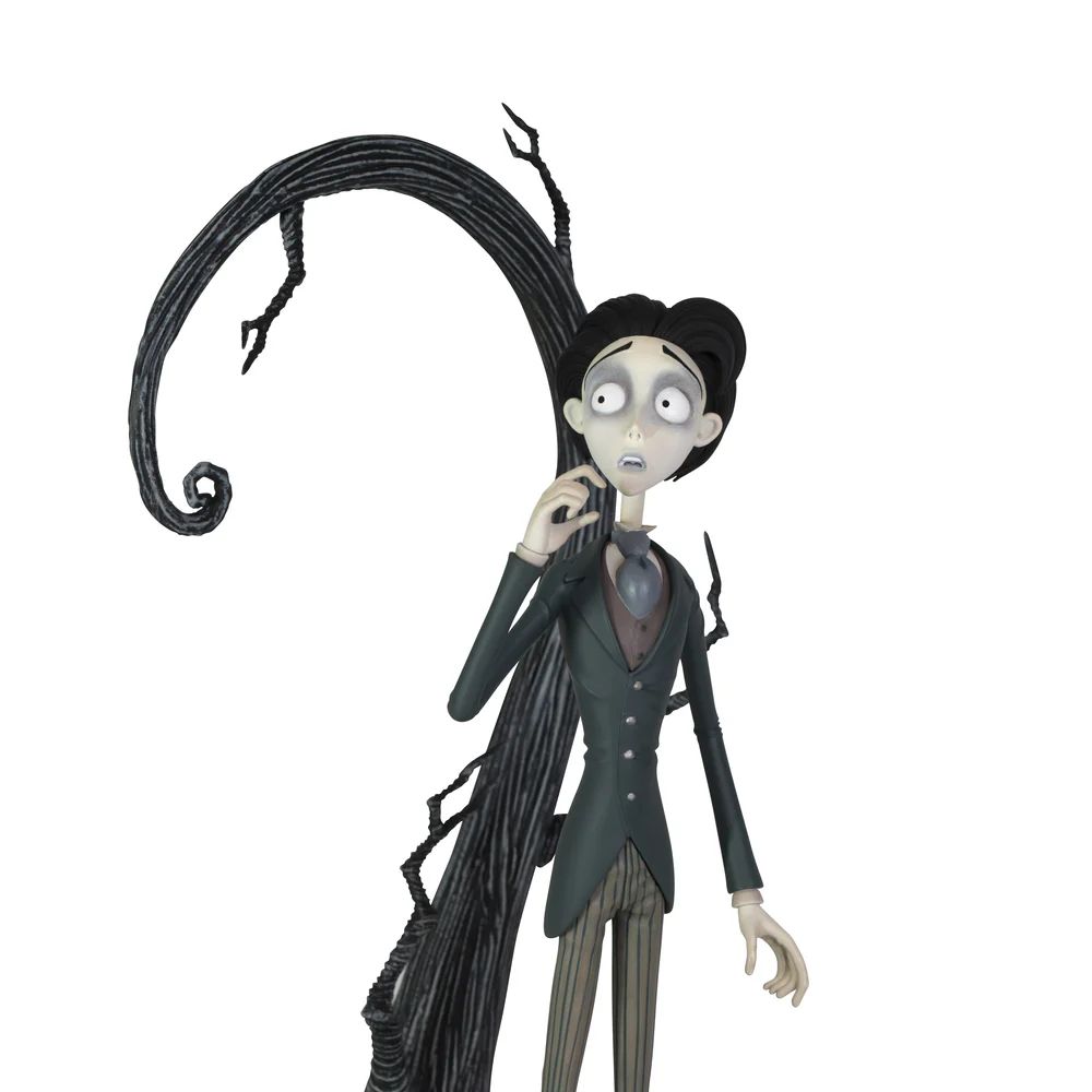 A highly detailed vinyl figurine of Victor Van Dort from Tim Burton's Corpse Bride standing in a black suit on a cobblestone display base with a nervous expression