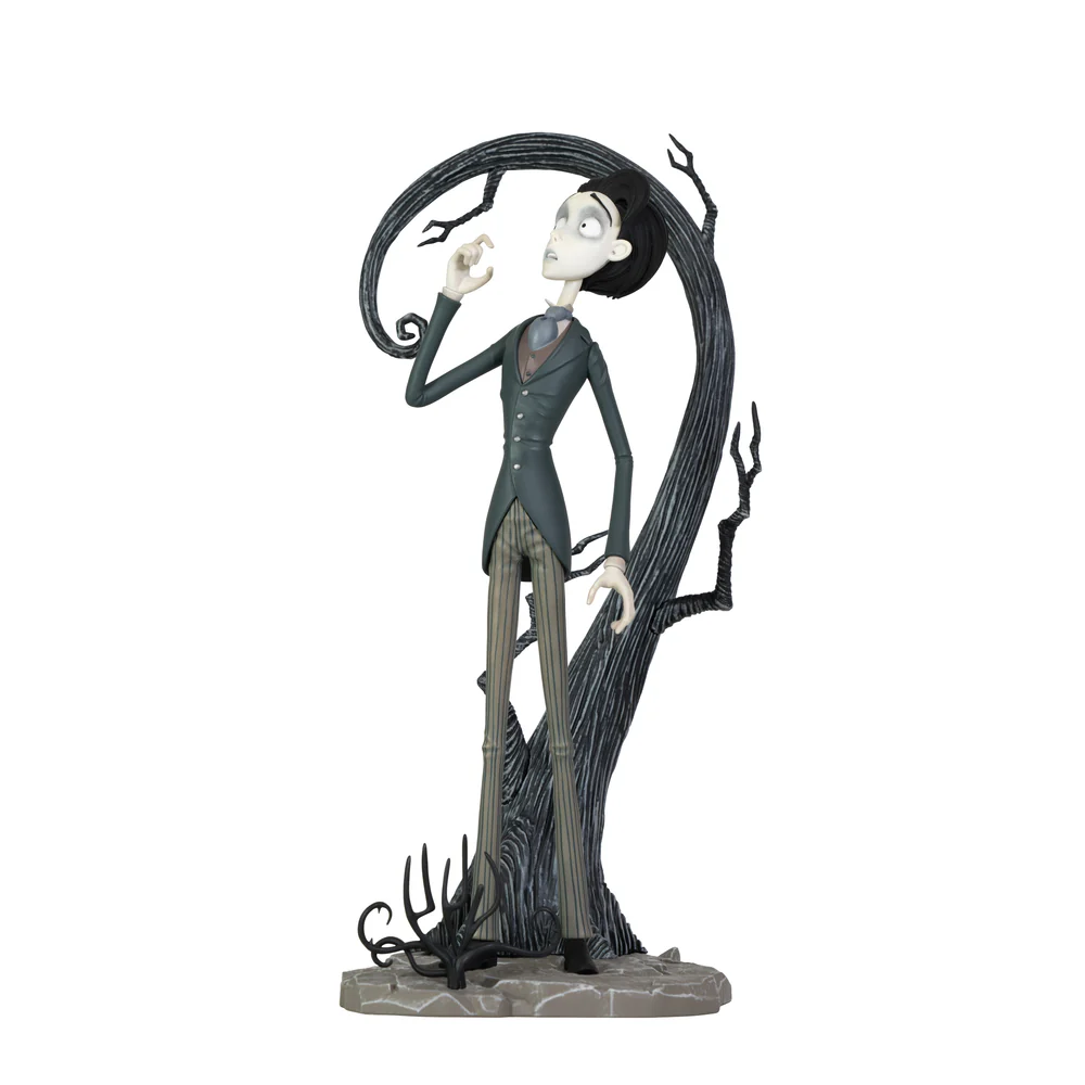 A highly detailed vinyl figurine of Victor Van Dort from Tim Burton's Corpse Bride standing in a black suit on a cobblestone display base with a nervous expression