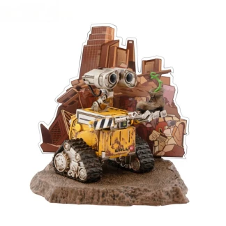A highly detailed vinyl figurine of Disney Pixar's Wall-E standing on a small trash-heap themed display base, featuring weathered rust details and large expressive eyes