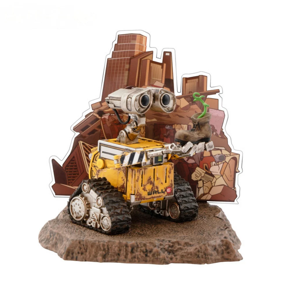 A highly detailed vinyl figurine of Disney Pixar's Wall-E standing on a small trash-heap themed display base, featuring weathered rust details and large expressive eyes