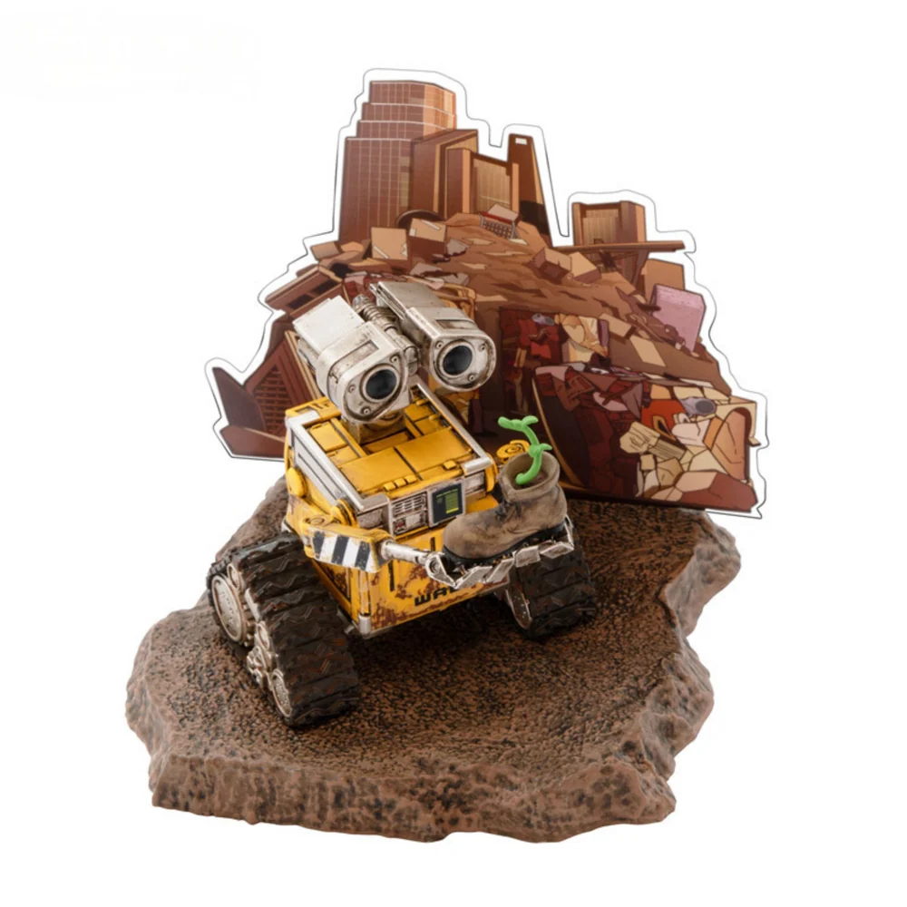 A highly detailed vinyl figurine of Disney Pixar's Wall-E standing on a small trash-heap themed display base, featuring weathered rust details and large expressive eyes